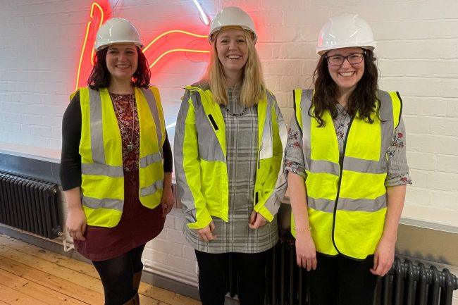 The photo shows (left to right) our head of PR, Faye, joint MD, Kirsty, and senior PR account manager, Liz, all wearing on-site PPE.